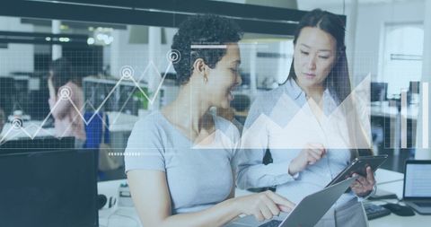 Businesswomen Analyzing Data with Financial Chart Overlay - Download Free Stock Images Pikwizard.com