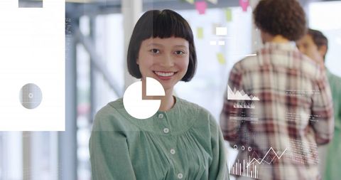 Smiling Woman in Office with Data Visualizations and Graphs - Download Free Stock Images Pikwizard.com