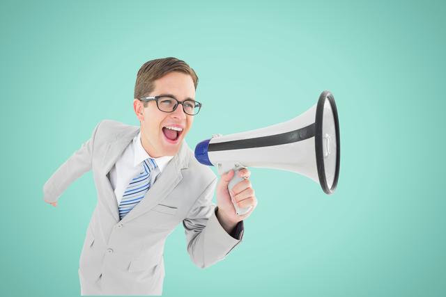 Excited Businessman Shouting Through Megaphone on Mint Green Background - Download Free Stock Photos Pikwizard.com