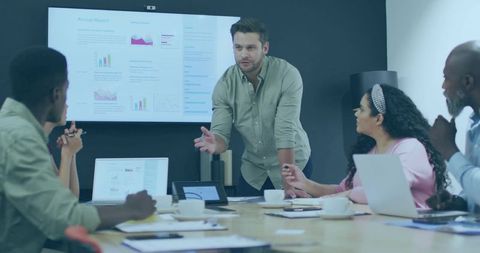 Dynamic Team Meeting with Leader Presenting Ideas