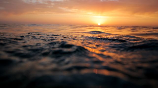 Serene Ocean Waves at Sunset With Golden Sky - Download Free Stock Photos Pikwizard.com