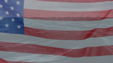 American Flag Blending with Ocean Waves Symbolizing Unity