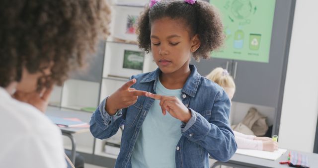 Young African American Girl Counting on Fingers in Classroom - Download Free Stock Images Pikwizard.com