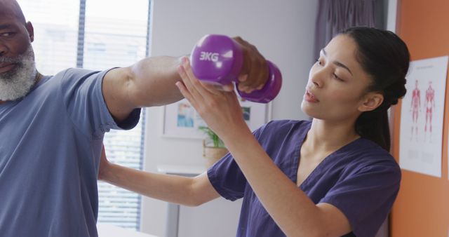 Physical Therapist Assisting Senior With Arm Exercises in Clinic - Download Free Stock Images Pikwizard.com