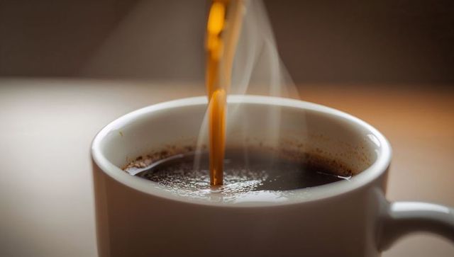 Pouring Coffee into White Ceramic Mug with Steam and Crema, Cozy Morning Macro