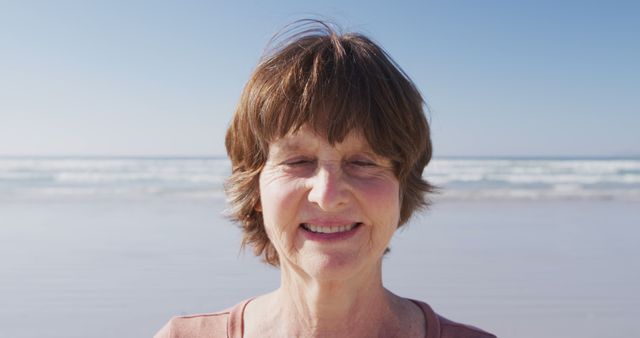 Smiling Elderly Woman Enjoying Day at the Beach - Download Free Stock Images Pikwizard.com