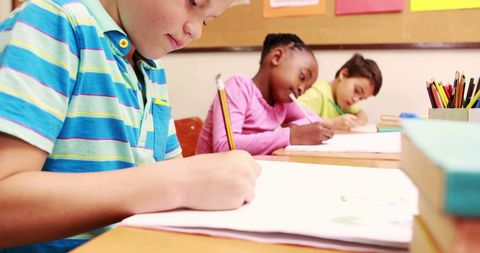Diverse Children Engaged in Classroom Writing Activity - Download Free Stock Images Pikwizard.com