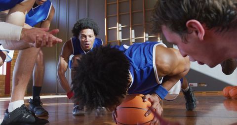 Motivated Diverse Basketball Team Exercising on Indoor Court