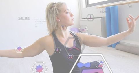 Woman stretching and balancing in studio with biometric overlays and minimalist yoga gear