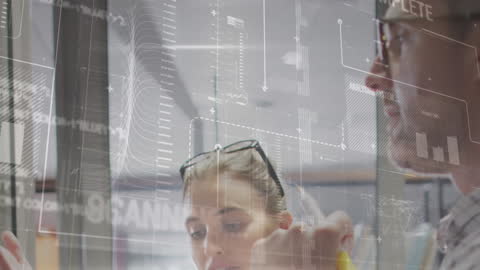 Innovative Team Analyzing Digital Data in Modern Office