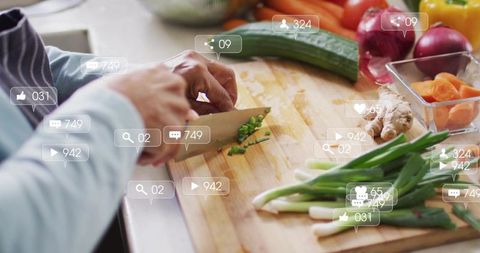 Chopping scallions with chef knife while social media overlays showing engagement