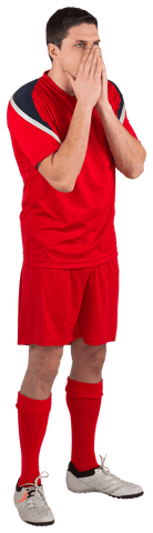 Transparent nervous football player in red uniform looking ahead