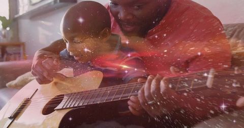 Father and Son Bonding Time with Acoustic Guitar and Magical Ambiance