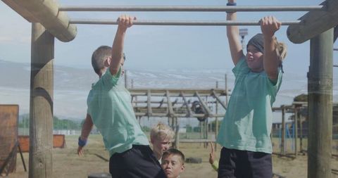 Children Enjoying Outdoor Monkey Bars on Sunny Day