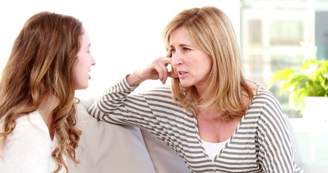 Mother and Teen Daughter Conversing on Couch - Download Free Stock Images Pikwizard.com