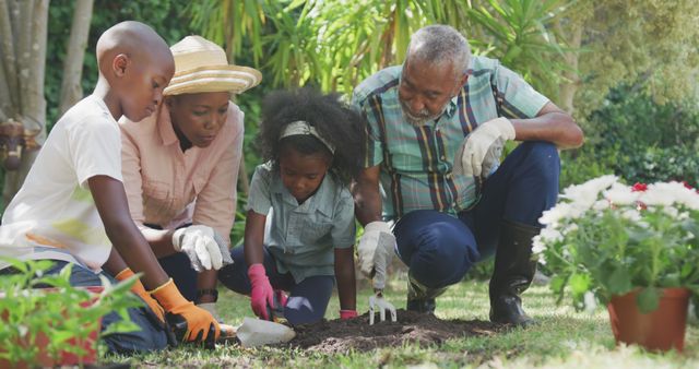 Happy african american grandparents and grandchildren gardening together. Lifestyle, domestic life, hobby, family, and togetherness.