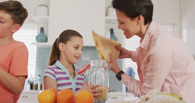 Mother and Children Preparing Breakfast Together in Kitchen - Download Free Stock Images Pikwizard.com