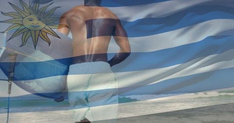 Surfer walking to ocean with uruguay flag overlay on sunny beach