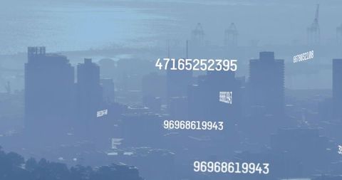 City skyline emerging through mist with floating numeric data overlays for smart city visuals