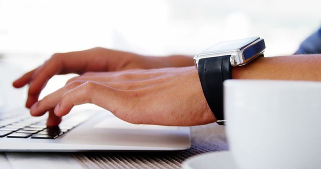 Close-Up of Hands Typing on Laptop Keyboard with Smartwatch and Coffee Mug - Download Free Stock Images Pikwizard.com