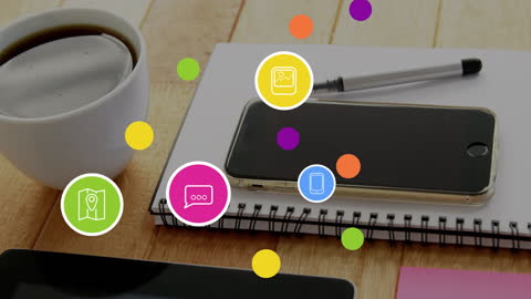 Digital Media Icons Hovering Above Technology and Coffee