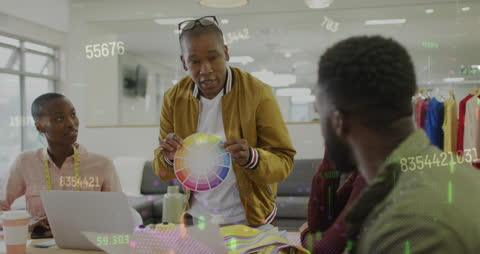 Diverse Team Analyzing Color Wheel with Financial Overlays