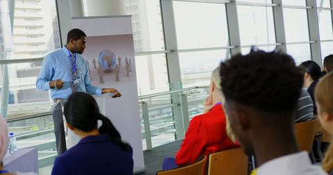 Dynamic Male Speaker Engaging Audience at Business Seminar - Download Free Stock Images Pikwizard.com