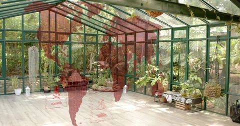 Glasshouse conservatory featuring lush potted plants with red world map overlay
