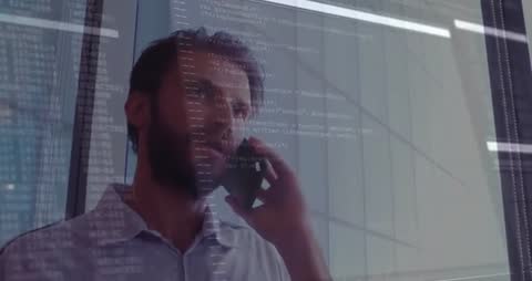 Businessman in Office with Coding Overlay on Glass Wall