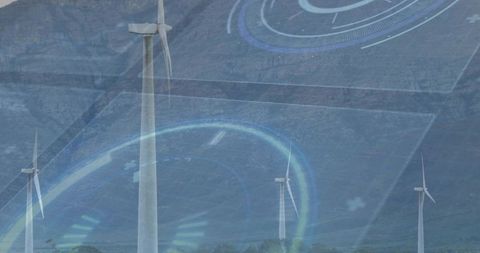 Wind turbines rising over mountain valley with digital hud overlay for renewable energy tech