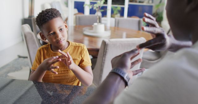 Father Teaching Son Sign Language in Modern Home Interior - Download Free Stock Images Pikwizard.com