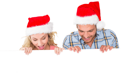 joyful couple in santa hats peeking behind blank board, transparent background - Download Free Stock Videos Pikwizard.com