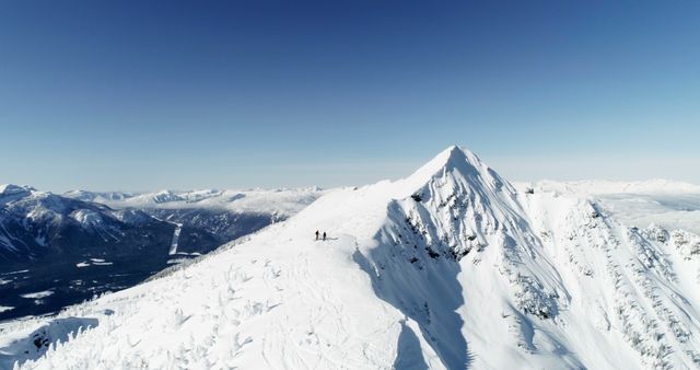 Group Hiking on Snow-Covered Mountain Peak - Download Free Stock Images Pikwizard.com