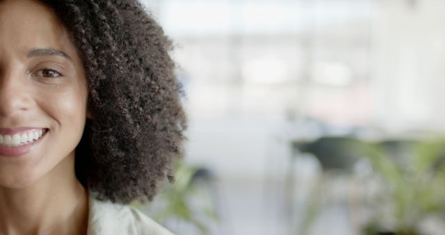 Half-Faced Smiling Woman with Curly Hair in Bright Environment - Download Free Stock Images Pikwizard.com