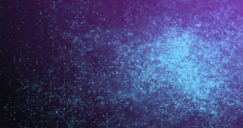 Abstract Glowing Particles in Motion Over Dark Background - Download Free Stock Images Pikwizard.com