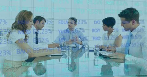 Business Team Analyzing Financial Data at Meeting