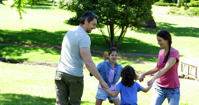 Happy Family Playing Together Outdoors in Park - Download Free Stock Images Pikwizard.com