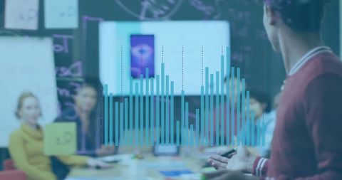 Business Team Analyzing Data Charts in Office Meeting Room