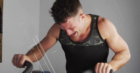 Intense Workout on Stationary Bike with Modern Digital Overlay