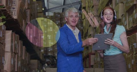 Warehouse Management Team Reviewing Digital Inventory