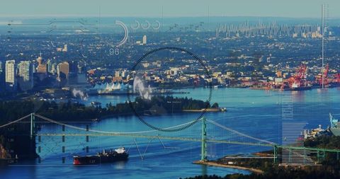 Green suspension bridge spanning harbor with cargo ship and port hud data overlay