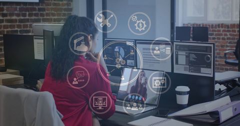 Asian Professional Analyzing Data with Futuristic Interface in Office