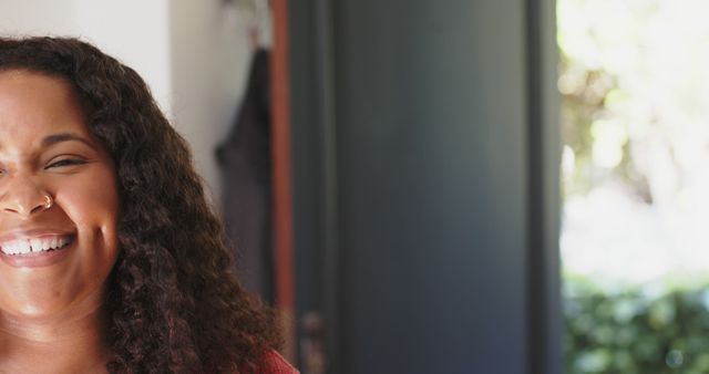 Smiling Woman with Curly Hair and Nose Ring - Download Free Stock Images Pikwizard.com