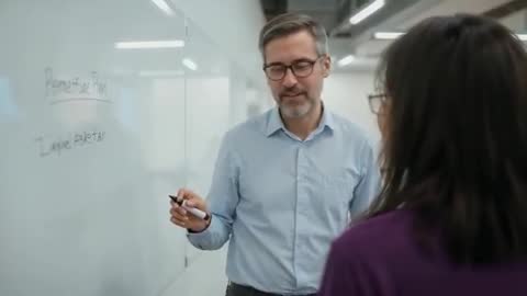 Man Discussing Perspective Plan with Whiteboard in Modern Office