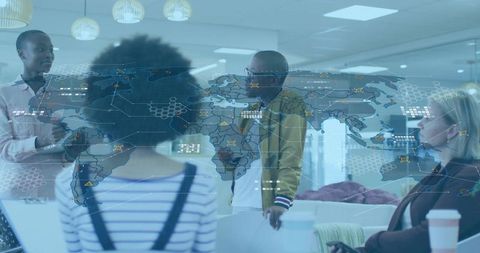 Team Collaborating Around Holographic World Map During Office Strategy Meeting