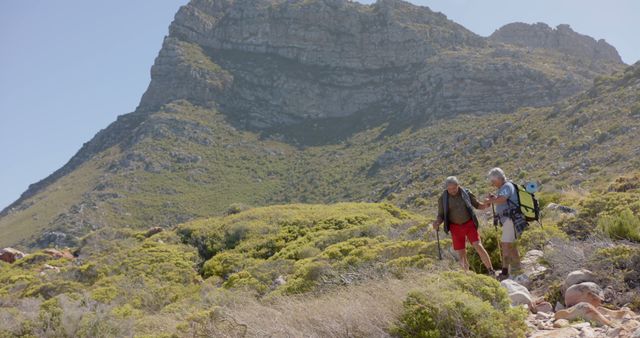 Senior Couple Hiking in Rocky Mountain Landscape Under Clear Sky - Download Free Stock Images Pikwizard.com