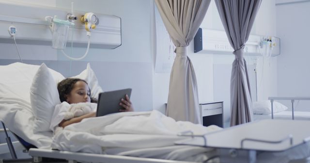 Sick Child Lying in Hospital Bed Using Digital Tablet - Download Free Stock Images Pikwizard.com