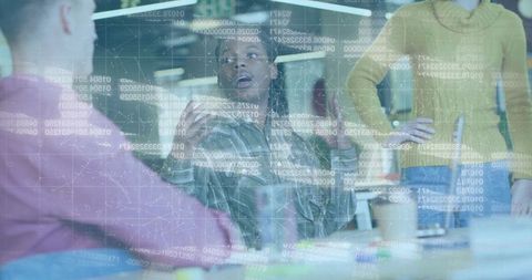 Business Professionals Analyzing Data on Transparent Screen in Modern Office