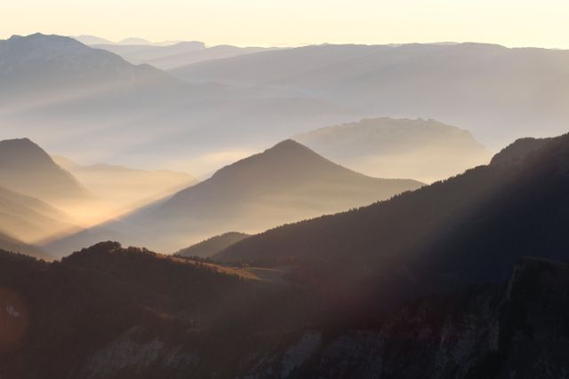 Sunrise Over Misty Mountain Range in Morning Light - Download Free Stock Photos Pikwizard.com
