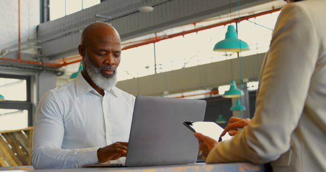 Professional Man Working on Laptop in Modern Office - Download Free Stock Images Pikwizard.com